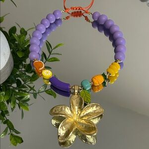 Handcrafted Purple and Yellow Beaded Necklace with Gold Flower Pendant